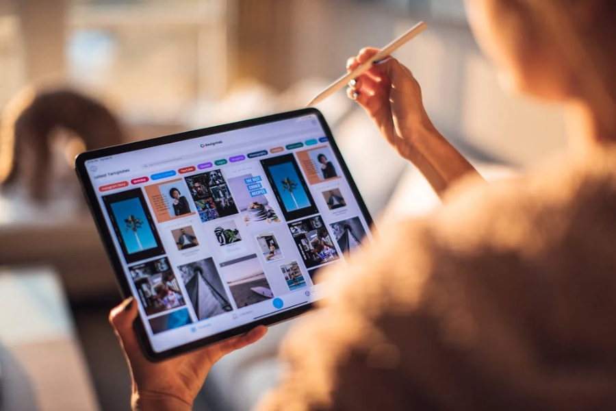 Person doing creative or design work on a tablet